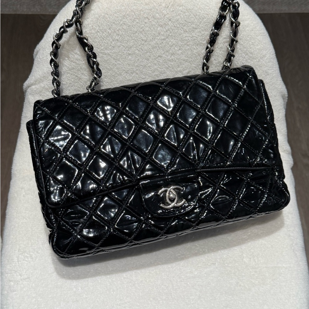 CHANEL Black Quilted Patent Leather Flap Bag with Silver Chain